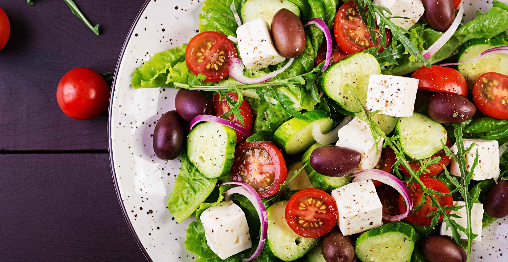 Greek salad with fresh vegetables, feta cheese and kalamata olives. Healthy food. Top view